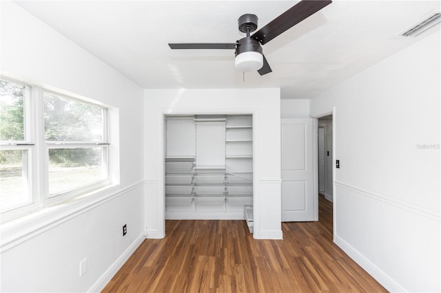 5508 Meridian Way, Orlando, FL 32808 - unfurnished bedroom featuring a closet, wood finished floors, baseboards, visible vents, and ceiling fan