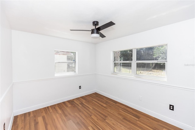 5508 Meridian Way, Orlando, FL 32808 - spare room featuring baseboards, wood finished floors, and a ceiling fan