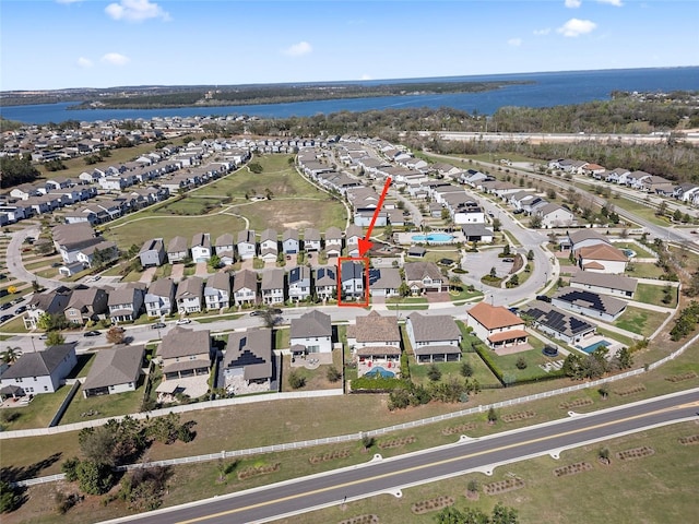 aerial view featuring a water view and a residential view