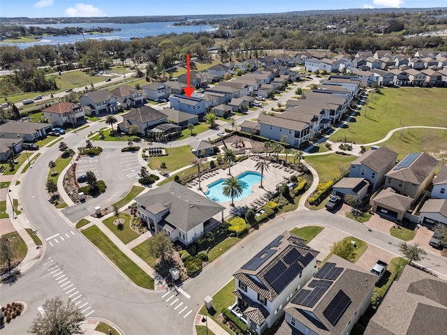 birds eye view of property with a residential view and a water view