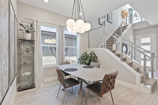 dining room with stairs, recessed lighting, baseboards, and a healthy amount of sunlight