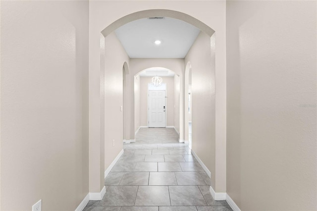 corridor featuring light tile patterned flooring