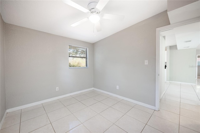 tiled empty room with ceiling fan