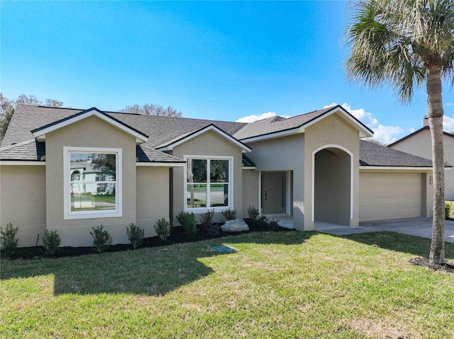 ranch-style home featuring a garage and a front lawn