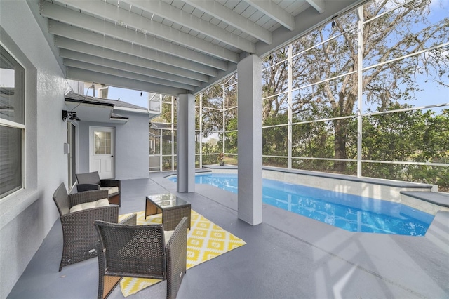 outdoor pool featuring a lanai, a patio area, and outdoor lounge area