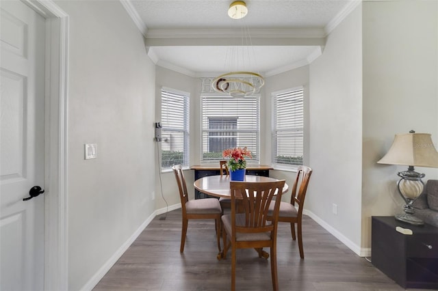 dining space with crown molding, dark wood finished floors, and baseboards