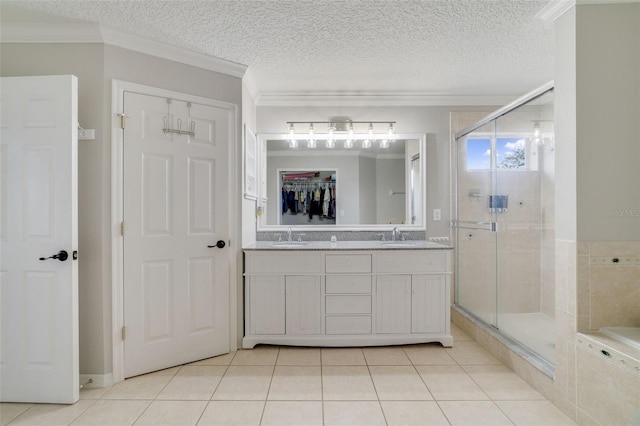 bathroom featuring crown molding, tile patterned flooring, a sink, and a shower stall