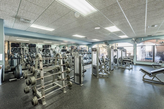 exercise room featuring visible vents and a drop ceiling