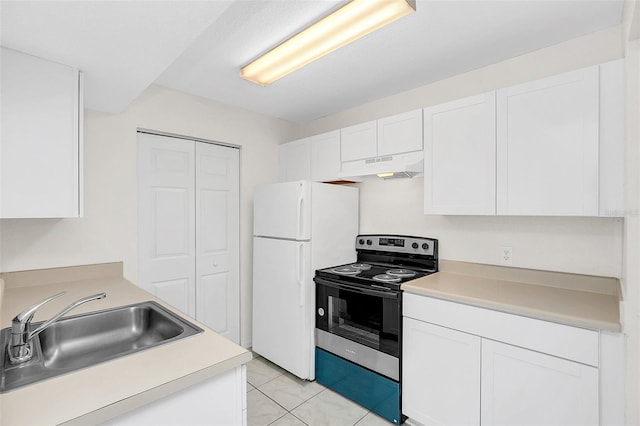 kitchen with light tile patterned flooring, white cabinetry, sink, white refrigerator, and electric stove