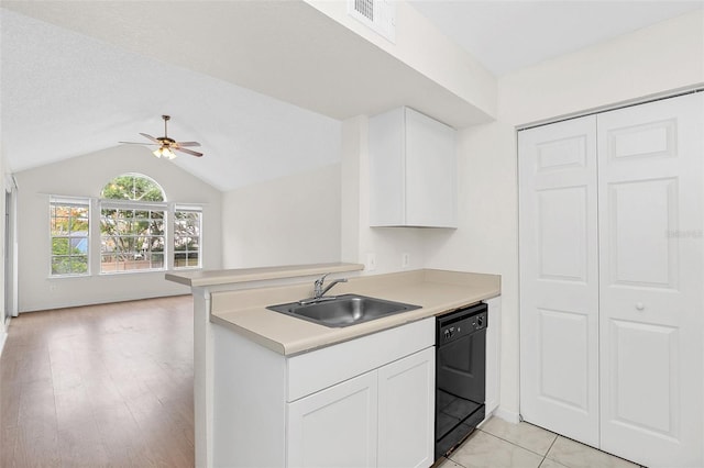 kitchen with sink, white cabinetry, black dishwasher, kitchen peninsula, and ceiling fan