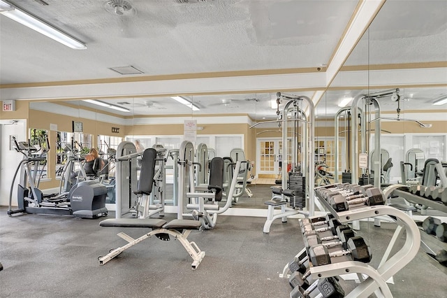 exercise room featuring a textured ceiling