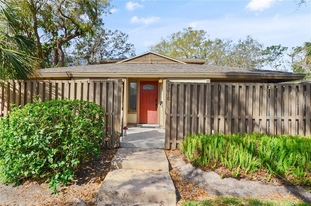 view of front of home with fence