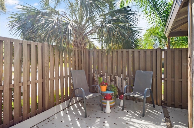 view of patio featuring fence