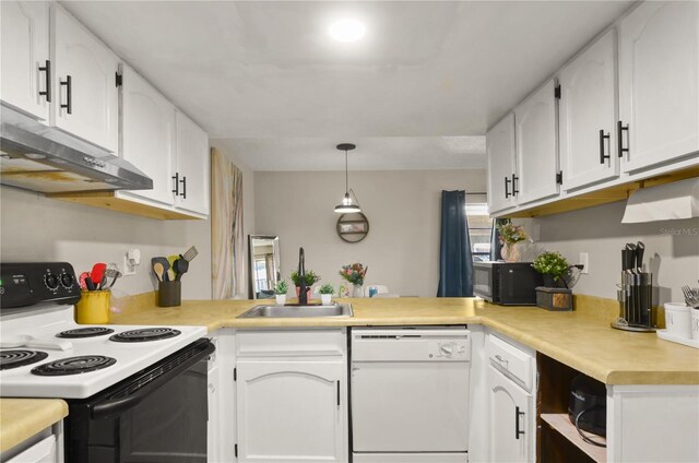 kitchen with electric stove, white cabinets, white dishwasher, a peninsula, and under cabinet range hood