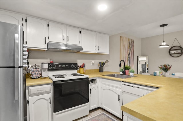 kitchen with white appliances, light countertops, a sink, and under cabinet range hood