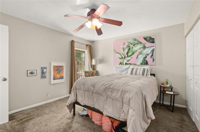 carpeted bedroom featuring a ceiling fan, baseboards, and a closet