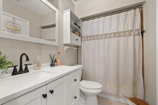 full bathroom featuring curtained shower, vanity, toilet, and tile patterned floors