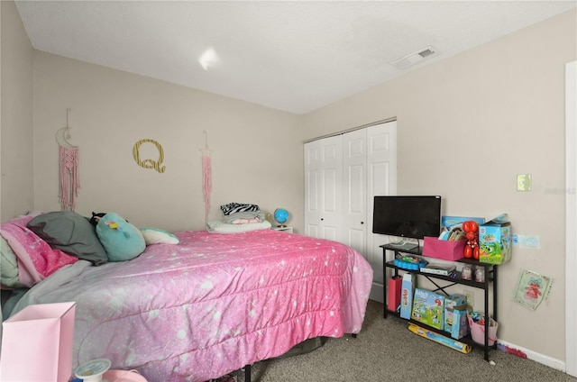 carpeted bedroom featuring a closet, visible vents, and baseboards