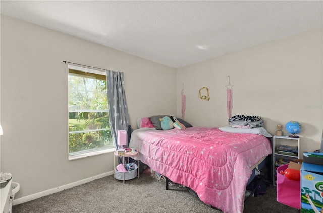 bedroom featuring carpet floors and baseboards