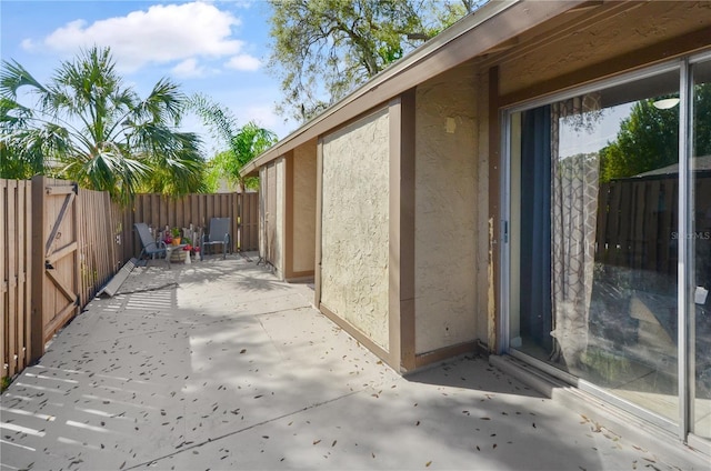 view of patio featuring fence