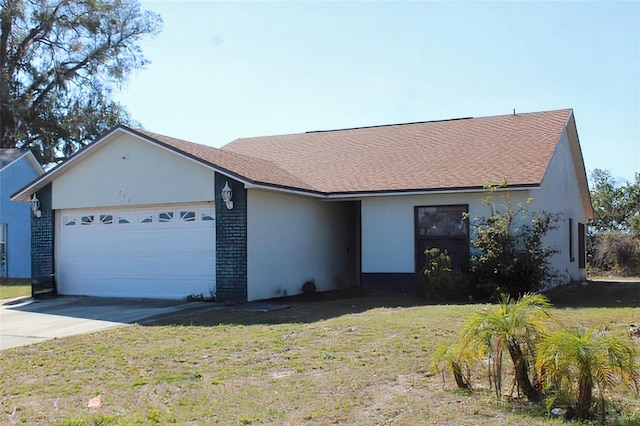 single story home featuring a garage and a front yard