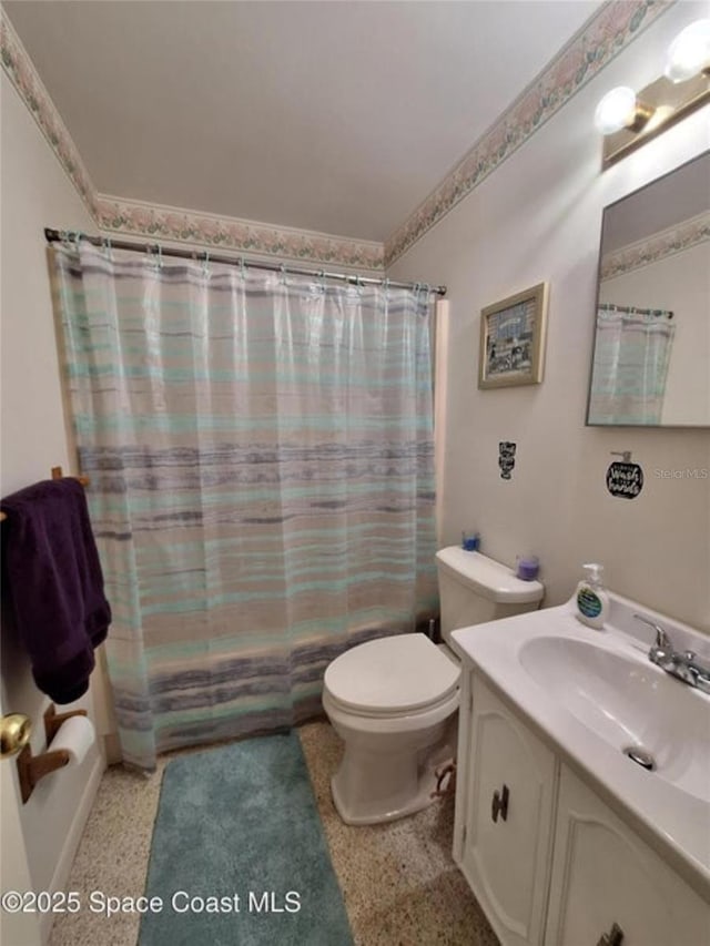 full bathroom with shower / bath combination with curtain, vanity, and toilet