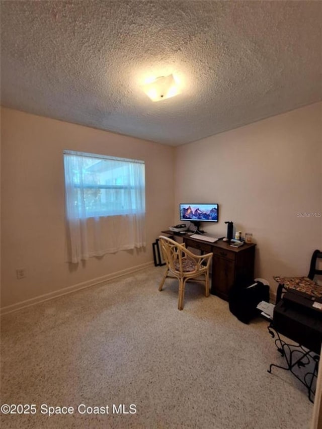 office area featuring a textured ceiling