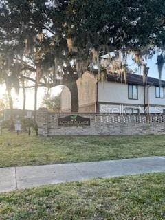 4944 Sanoma Vlg Unit D, Orlando, FL 32808 - community sign featuring a lawn
