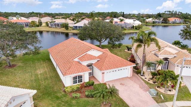 birds eye view of property with a water view