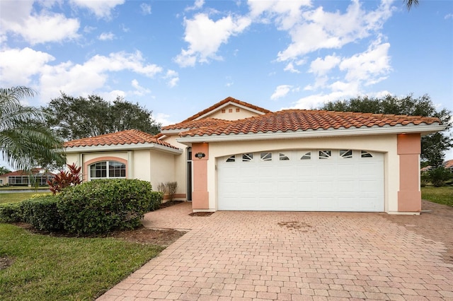 mediterranean / spanish-style home featuring a garage