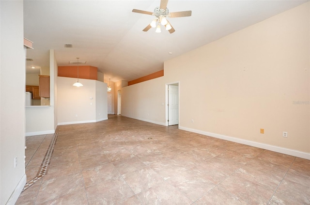 empty room featuring vaulted ceiling and ceiling fan