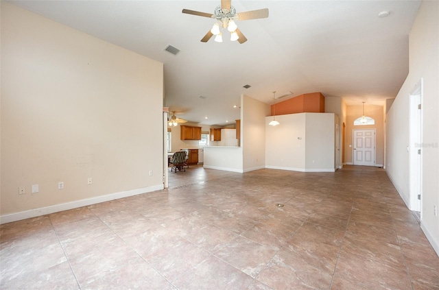 unfurnished living room featuring vaulted ceiling and ceiling fan