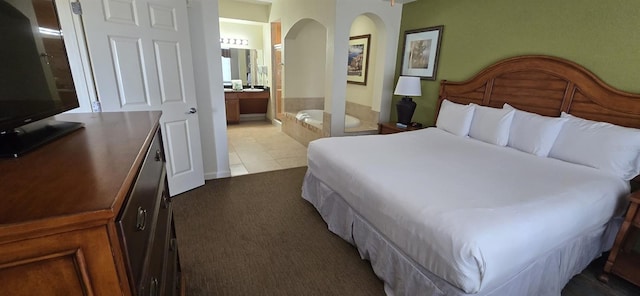 tiled bedroom with ensuite bath