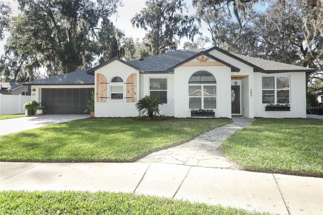 ranch-style house featuring a garage and a front yard