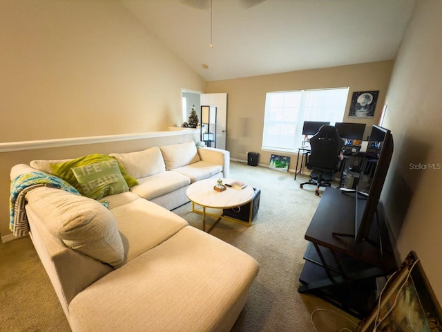 living room featuring carpet and high vaulted ceiling