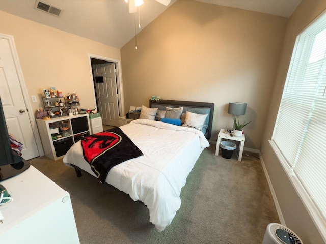 bedroom with vaulted ceiling, ceiling fan, and carpet floors