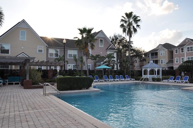 view of pool featuring a patio, a pergola, and a gazebo