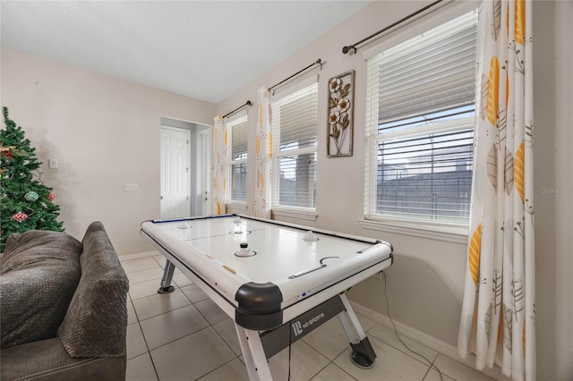 game room with tile patterned floors