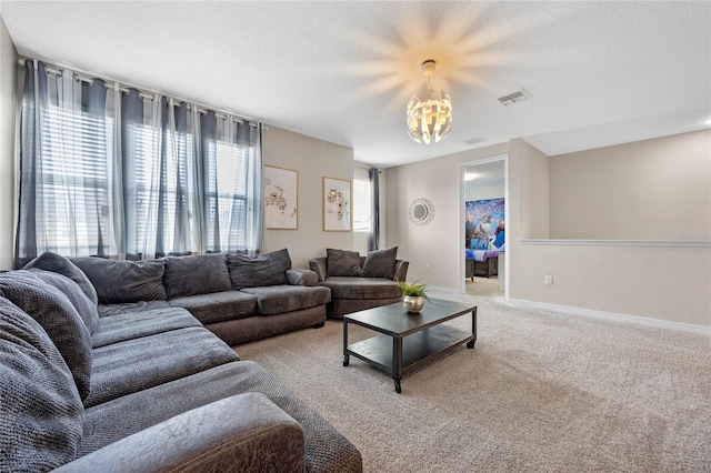 living room featuring carpet floors and a textured ceiling