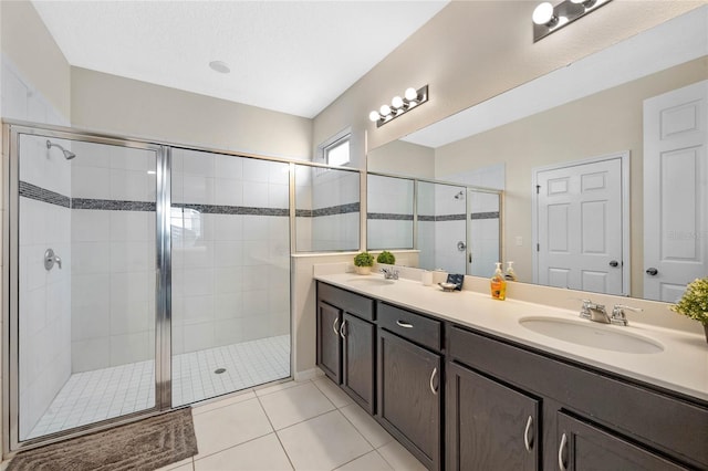 bathroom with vanity, tile patterned floors, and a shower with shower door