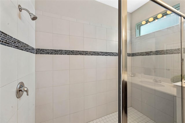 bathroom with a shower with shower door