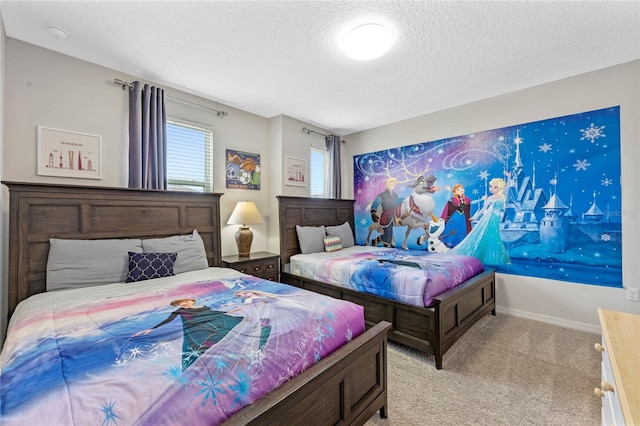 bedroom featuring light colored carpet and a textured ceiling