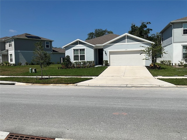 view of front of home with a garage, a residential view, concrete driveway, and a front lawn