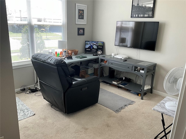 carpeted living room with baseboards