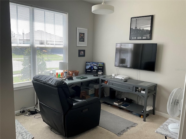 office space with light carpet and baseboards