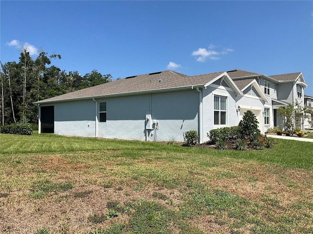 view of property exterior featuring a yard and stucco siding