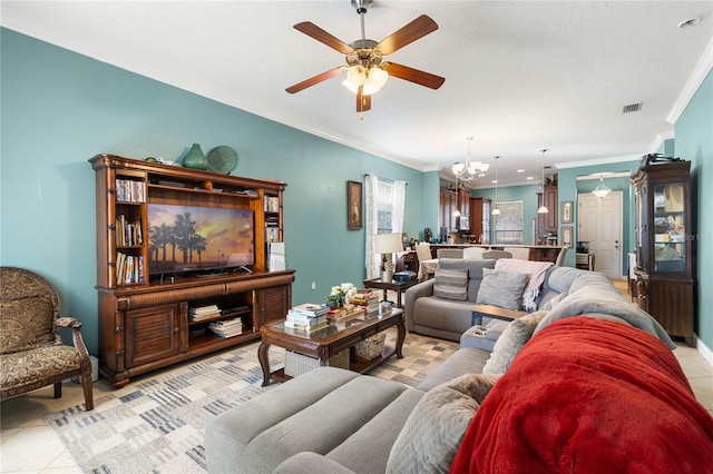 tiled living room featuring ceiling fan with notable chandelier and ornamental molding