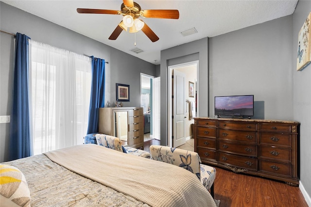 bedroom with wood-type flooring and ceiling fan