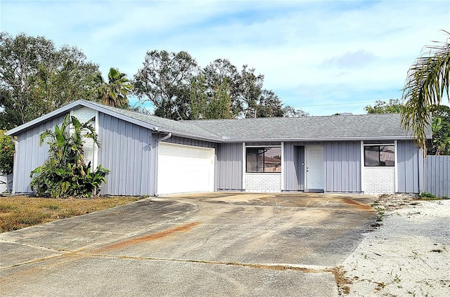 single story home with a garage