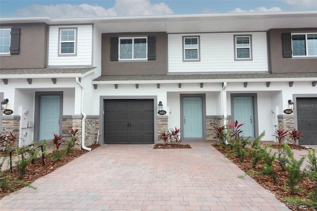 3031 Pilot House Pl, Oviedo, FL 32765 - townhome / multi-family property with a garage